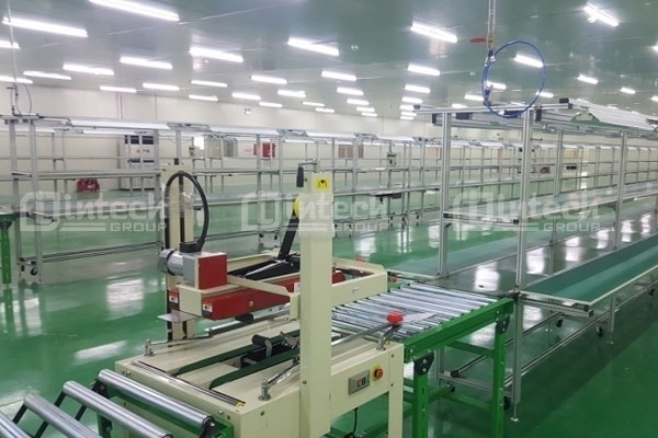 Băng tải con lăn kết hợp máy đóng gói