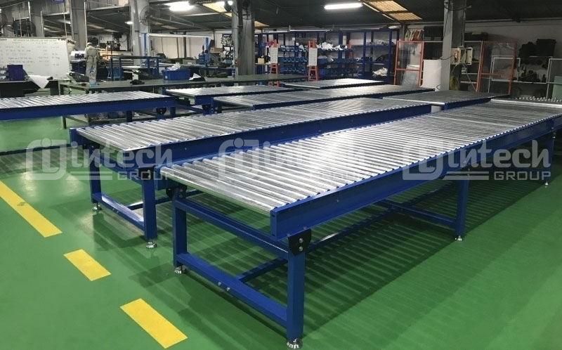 Định nghĩa Hệ thống băng tải con lăn là gì?